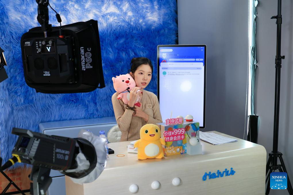 Child interacts with AI toy Fuzozo at inno100 flagship store